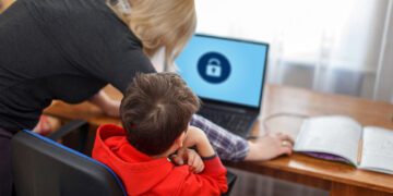 Mother locking on computer for son, parental control