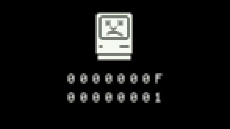 صفحه نمایش خاموش سیستم عامل قدیمی (احتمالاً Mac OS) با تصویر یک کامپیوتر کوچک پیکسلی غمگین و کدهای پیکسلی "0000000F" که نماد خرابی است.