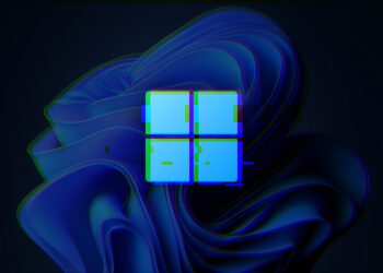 لوگوی ویندوز (چهار مربع آبی) که با افکت نقص دیجیتالی (Glitch) در مقابل پس‌زمینه آبی تیره و موج‌دار (طرح Bloom ویندوز ۱۱) قرار گرفته است.