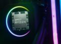 نمای نزدیک یک پردازنده AMD Ryzen در داخل یک سوکت با نورهای نئون در اطراف.