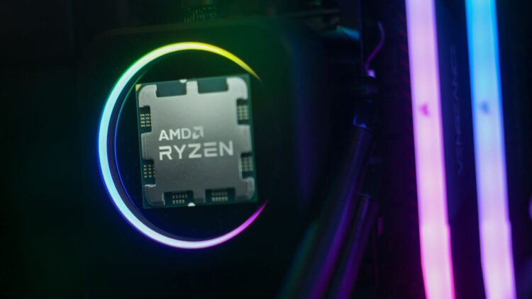 نمای نزدیک یک پردازنده AMD Ryzen در داخل یک سوکت با نورهای نئون در اطراف.