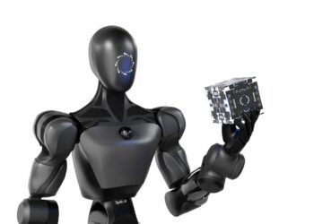 رندر سه بعدی یک ربات انسان‌نما که قطعه‌ای صنعتی را در دست نگه داشته است.