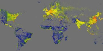 نقشه حرارتی تراکم ساختمان‌ها در سراسر کره زمین با نقاط زرد و آبی.