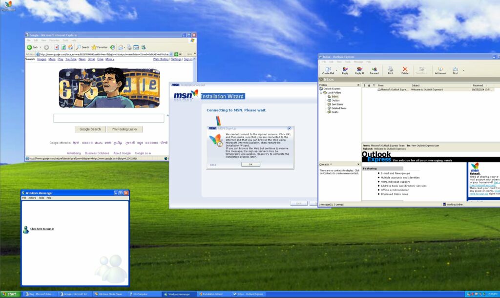 دسکتاپ نوستالژیک ویندوز XP با پنجره‌های باز MSN Messenger و Outlook Express.