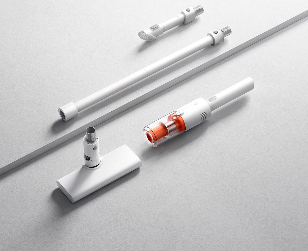 نمایش قطعات جدا شده، لولهها و سریهای مختلف جاروبرقی سبک Mijia روی سطح سفید.