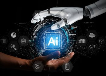 تصویری از یک دست انسان و یک دست ربات که کره‌ای که مرکز آن نوشته شده AI را نگه داشته‌اند.