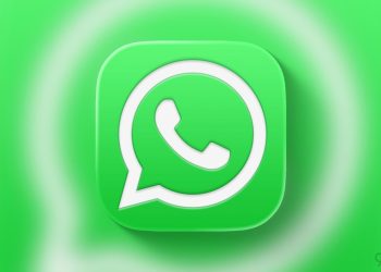 آیکون سفید و سبز اپلیکیشن واتس‌اپ با افکت درخشش در پس‌زمینه.