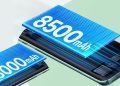 نمای گرافیکی از دو باتری بزرگ با ظرفیت‌های 8000mAh و 8500mAh که بر روی بدنه داخلی یک گوشی هوشمند قرار گرفته‌اند.