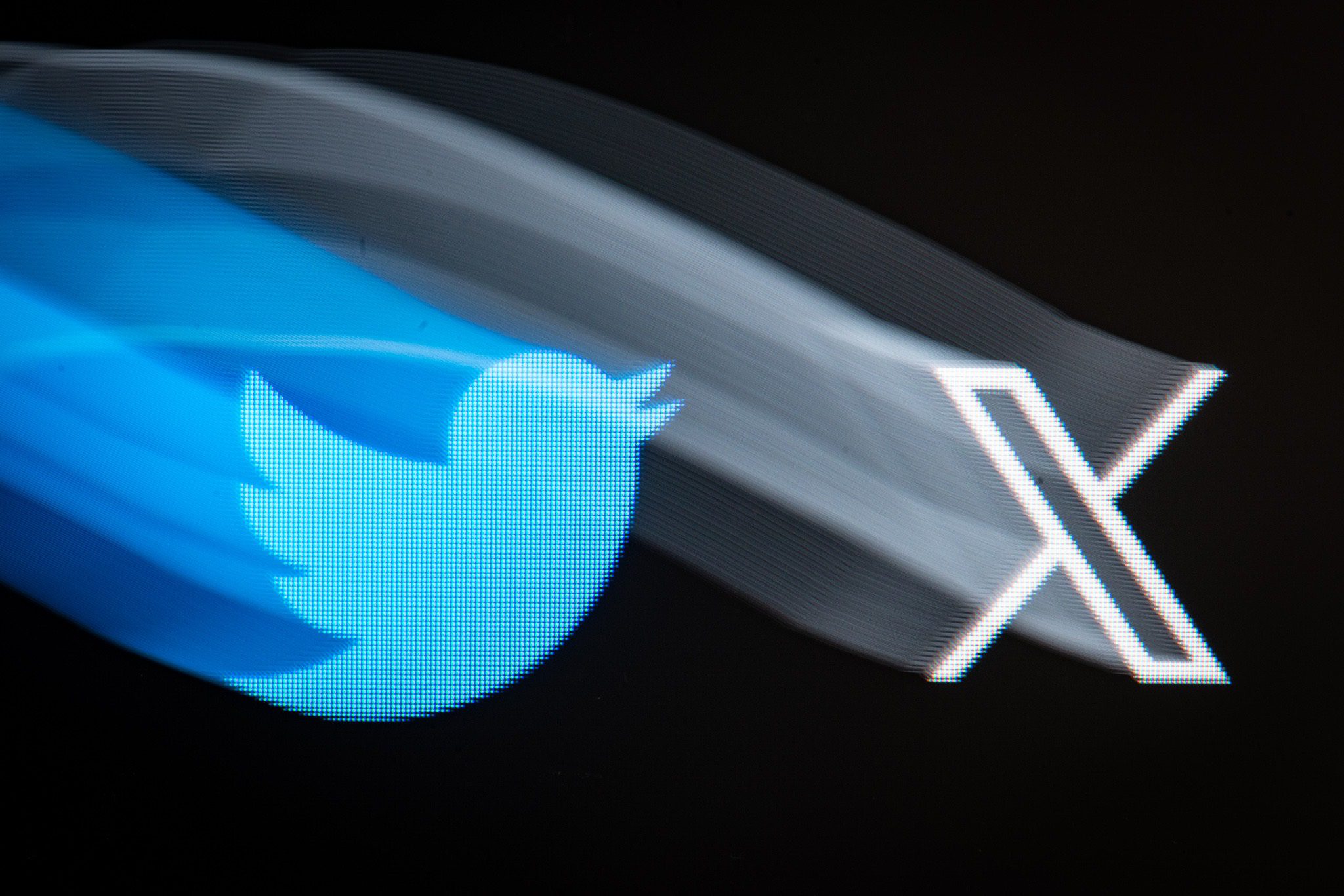 A longexposure shot shows both old and new version of Twitter logo displayed on a personal computer in L'Aquila, Italy, on July 25, 2023. Twitter announces a new logo for its company and social network.  (Photo by Lorenzo Di Cola/NurPhoto via Getty Images)