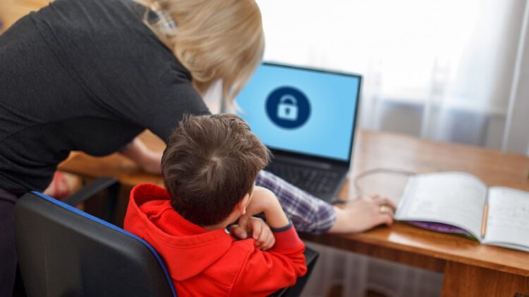 Mother locking on computer for son, parental control