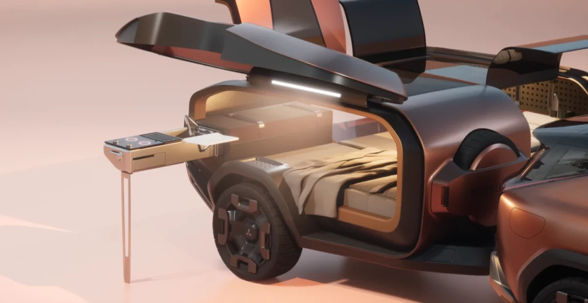 . تریلر متصل به Mitsubishi Elevance با آشپزخانه کشویی شامل اجاق برقی و فضای خواب داخلی مدرن.