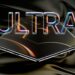 یک رندر مفهومی از یک گوشی تاشو (احتمالاً iPhone Ultra) که به صورت بسته روی پارچه‌ای مشکی/طلایی براق قرار دارد و کلمه نئونی "ULTRA" با افکت شیشه‌ای در بالای آن دیده می‌شود.