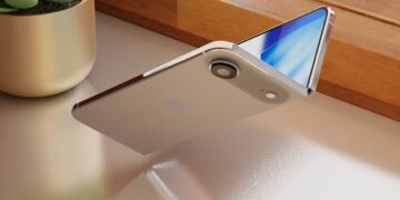 تصویر رندر شده از طرح مفهومی یک آیفون تاشو با طراحی صدفی که به صورت نیمهباز روی میز قرار دارد.