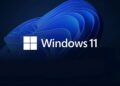 لوگوی Windows 11 در مقابل یک پس‌زمینه آبی تیره و موج‌دار.