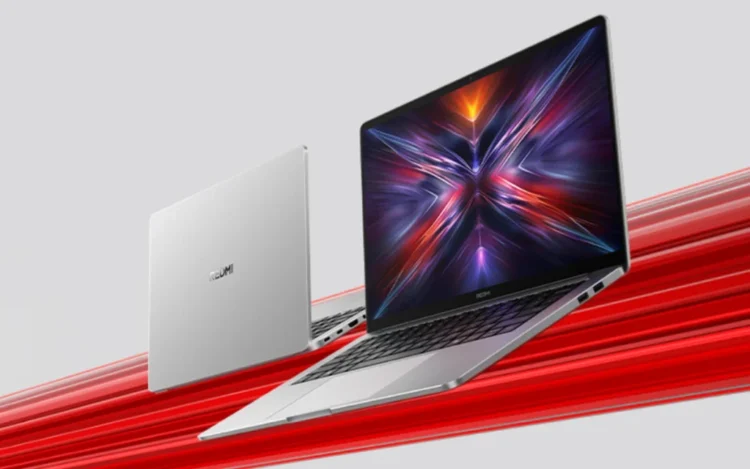 نمای رسمی لپ‌تاپ Xiaomi Redmi Book 16 مدل 2025 با طراحی مینیمال نقره‌ای، بدنه باریک و نمایش گرافیک انتزاعی رنگارنگ روی نمایشگر