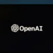 لوگوی سفید شرکت OpenAI در پس‌زمینه سیاه مانیتور.