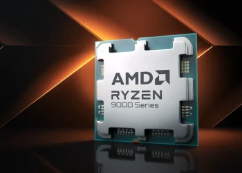 رندر تبلیغاتی از پردازنده AMD Ryzen 9000 Series با نمای روبهرو، شامل هیتاسپردر فلزی نقرهای با لوگوی AMD و Ryzen، قرارگرفته روی برد سبز رنگ. پسزمینه تیره با خطوط نور نارنجی مورب، بر قدرت پردازشی، طراحی مدرن و تمرکز بر کارایی نسل جدید پردازندههای AMD تأکید دارد.