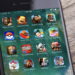 نمای نزدیک از صفحه یک گوشی هوشمند که مجموعه‌ای از آیکن بازی‌های موبایلی محبوب مانند Pokémon GO، Clash of Clans، Candy Crush، Hay Day و Madden Mobile را در قالب یک پوشه روی صفحه‌نمایش نشان می‌دهد.