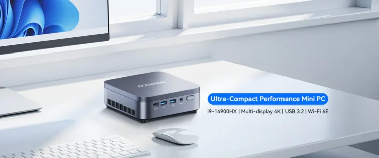 مینی پی‌سی خاکستری Acemagic روی میز کار در کنار موس و کیبورد با متن "Ultra-Compact Performance".