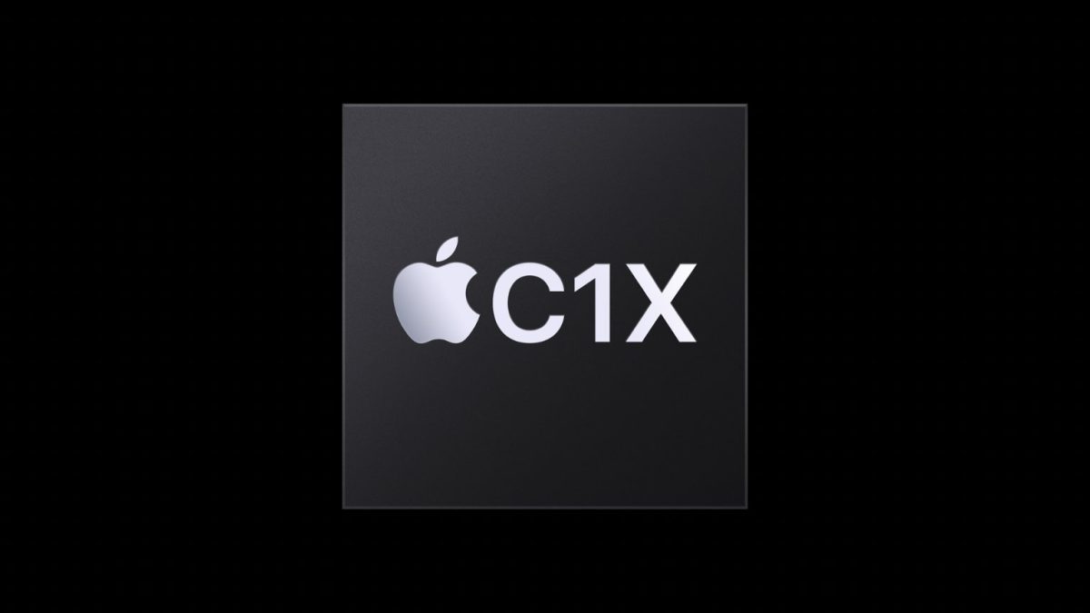 نمای نزدیک از یک پردازنده با لوگوی اپل و عنوان "C1X" بر روی پس‌زمینه کاملاً مشکی.