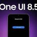 پوستر گرافیکی با متن بزرگ One UI 8.5 روی تصویر بالای یک گوشی هوشمند با دکمه دانلود.