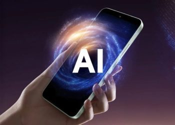 نمای مفهومی از گوشی هوشمند Xiaomi در حال اجرای ویژگی‌های AI در HyperOS، با هاله‌ای گرافیکی شبیه به کهکشان یا گردباد انرژی در نمایشگر دستگاه و تایپوگرافی برجسته «AI» در مرکز تصویر که به توان محاسباتی هوش مصنوعی اشاره دارد.