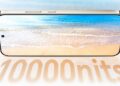 نمای روبهرو از پنل نمایشگر Honor X80 Pro Max که با والپیپر ساحلی روشن شده و عدد ۱۰,۰۰۰ نیت (10000 nits) به عنوان حداکثر روشنایی نمایشگر در پایین آن درج شده است