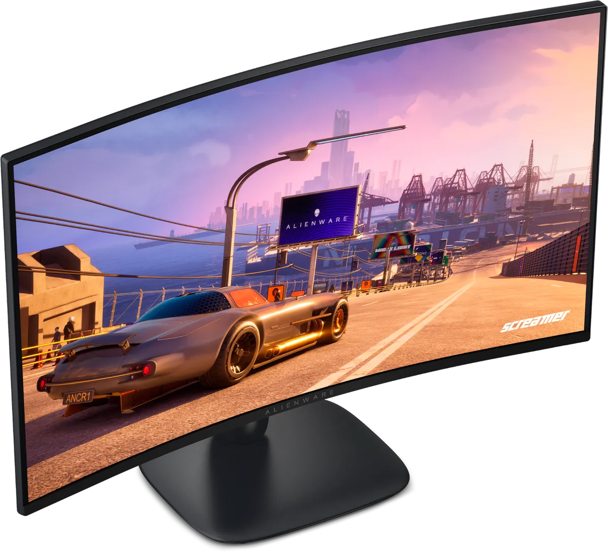 مانیتور گیمینگ Alienware در حال نمایش یک بازی مسابقهای با گرافیک واقعگرایانه؛ خودروی اسپرت در جاده ساحلی هنگام غروب و بیلبورد تبلیغاتی Alienware در محیط بازی