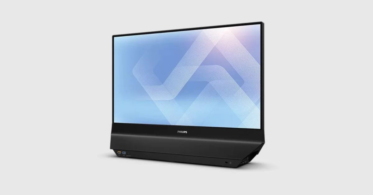 نمای سه رخ از مانیتور مشکی فیلیپس با پایه پهن و شیبدار که در قسمت جلویی دارای پورتهای USB و جک هدفون است. صفحه نمایش الگوی هندسی انتزاعی با خطوط سفید روی پسزمینه آبی را نشان میدهد.