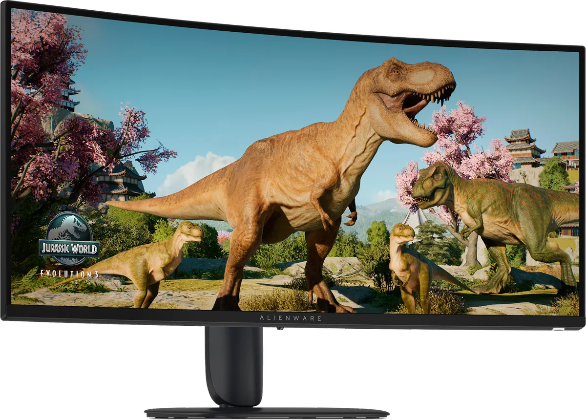 مانیتور گیمینگ خمیده Alienware با حاشیه بسیار باریک، در حال نمایش محیط بازی Jurassic World Evolution 3 با تصاویر دایناسورهای تیرکس و محیط سرسبز