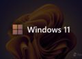لوگوی چهارپنجرهای و عبارت “Windows 11” روی پسزمینهای تیره با طرح سهبعدی طلایی؛ نشان Neowin در گوشه پایین تصویر دیده میشود