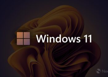 لوگوی چهارپنجرهای و عبارت “Windows 11” روی پسزمینهای تیره با طرح سهبعدی طلایی؛ نشان Neowin در گوشه پایین تصویر دیده میشود
