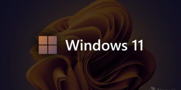 لوگوی چهارپنجرهای و عبارت “Windows 11” روی پسزمینهای تیره با طرح سهبعدی طلایی؛ نشان Neowin در گوشه پایین تصویر دیده میشود