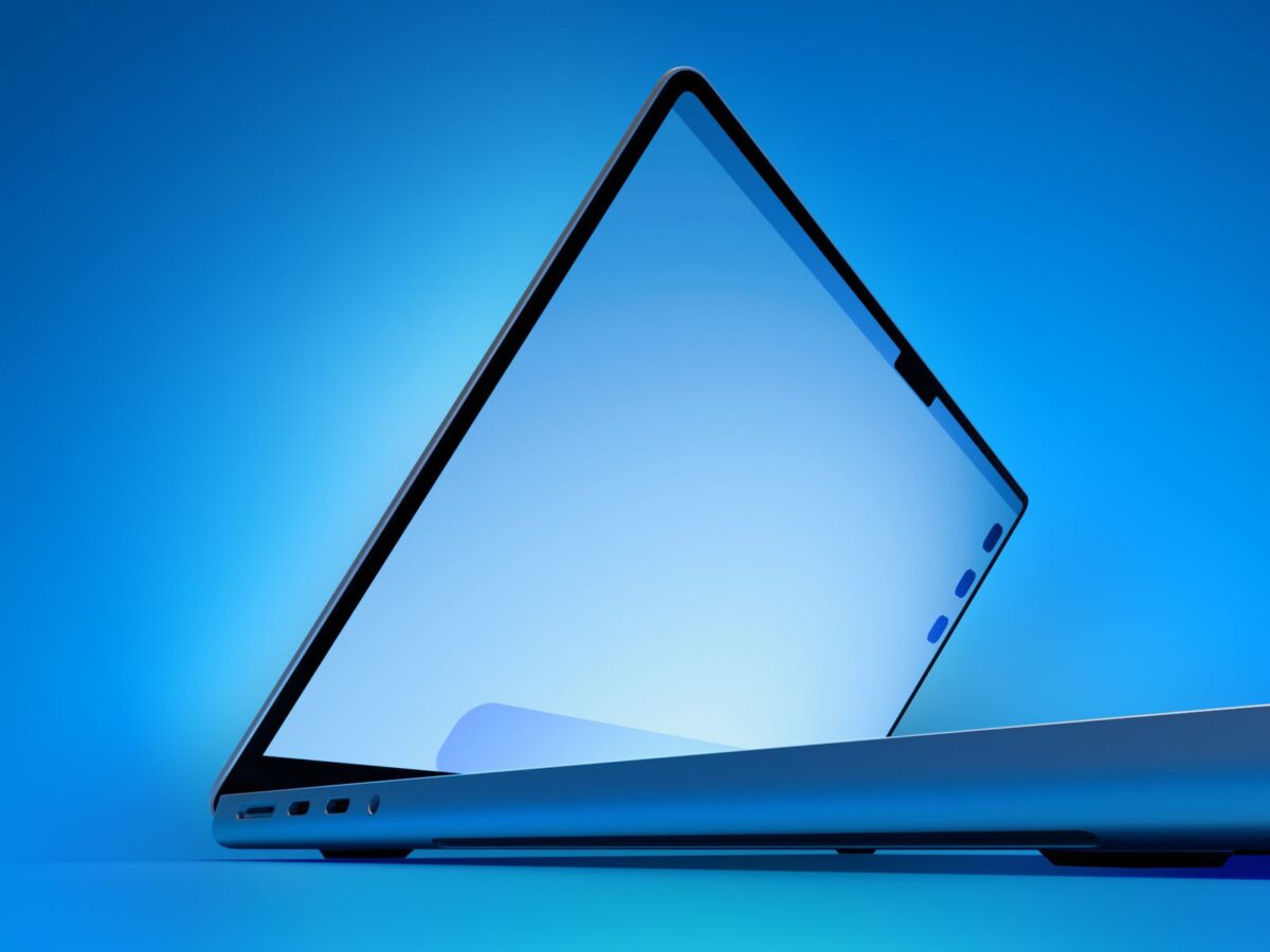 لپ‌تاپ MacBook Pro اپل با بدنه آلومینیومی و به رنگ خاکستری فضایی (Space Gray)، در محیطی کاملاً تاریک و با نورپردازی دراماتیک که فقط لبه‌ها و بخشی از کیبورد آن را روشن کرده است. این تصویر لوگوی براق اپل و پورت‌های USB-C/Thunderbolt را در زاویه‌ای بسته و مینیمالیستی نشان می‌دهد.