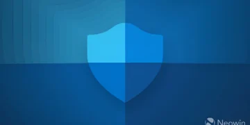 تصویر گرافیکی باکیفیت از آیکون سپر Windows Security که با سبک تخت و گرادینتهای آبی طراحی شده و روی پسزمینهای با طیفهای مختلف رنگ آبی قرار گرفته است؛ لوگوی Neowin نیز در گوشه پایین سمت راست دیده میشود.