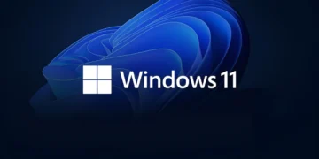لوگوی سفید Windows 11 روی پس زمینه تیره با طرح انتزاعی و موجی آبی رنگ.