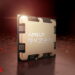 نمای نزدیک از تراشه AMD Ryzen با لوگوی برجسته AMD و Ryzen روی پوشش فلزی طلاییرنگ، در محیطی با نور قرمز.