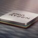 تصویر تبلیغاتی پردازنده AMD Ryzen با پوشش فلزی نقرهای روی یک سطح تیره با الگوی هندسی.
