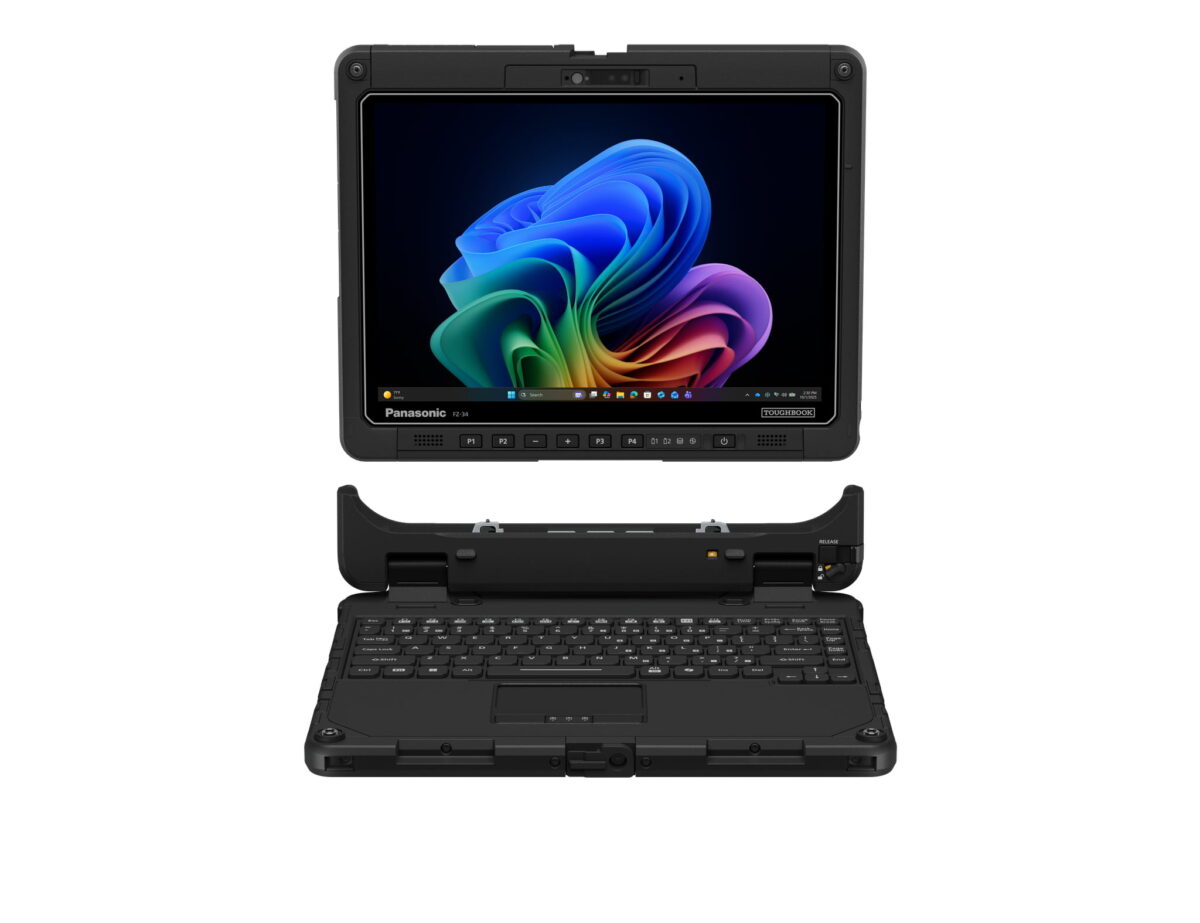 نمای روبهرو از تبلت صنعتی مقاوم Panasonic TOUGHBOOK FZ-34 با صفحه روشن و پسزمینه رنگی ویندوز ۱۱، به همراه داک کیبورد مقاوم جداشده در پایین با نور پسزمینه کلیدها و تاچپد در پسزمینه مشکی.