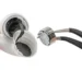 عکس کلوزآپ از جداسازی قطعات AirPods 5. دستی یک ایرباد سفید با پوسته شکافته را نگه داشته و با پنس مشکی، درایور بلندگوی نقرهای کوچک را از داخل آن بیرون میکشد. پسزمینه تصویر کاملاً سفید است.