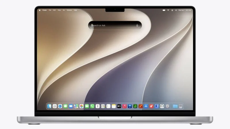 لپ‌تاپ نقره‌ای MacBook Pro با والپیپر موج‌دار کرم و خاکستری، نوار جست‌وجوی شناور در مرکز صفحه و ردیف آیکون‌های داک اپل در پایین نمایشگر.