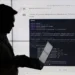 سیلوئت یک شخص در حال کار با لپتاپ در برابر یک نمایشگر بزرگ که کدهای پایتون (PyTorch CNN) روی آن نمایش داده شده است.