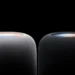 نمای نزدیک از بخش بالایی دو اسپیکر هوشمند HomePod اپل در رنگهای سفید و مشکی با پوشش پارچهای مشبک و سطح لمسی نورانی رنگی در پسزمینه کاملاً سیاه.
