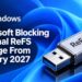 تصویر گرافیکی Windows با یک حافظه‌ی USB قفل‌شده و این پیام که Microsoft از ژانویه‌ی ۲۰۲۷ استفاده از ReFS را روی حافظه‌های خارجی مسدود می‌کند.