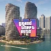 لوگوی رنگارنگ Grand Theft Auto VI روی نمایی از ساختمانهای ساحلی و برجهای بلند کنار آب، با قایقهایی در پیشزمینه.
